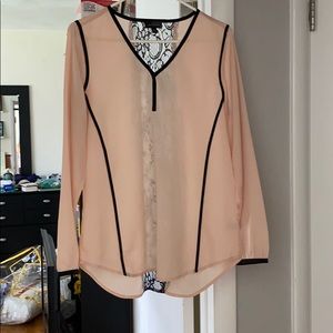 A pink and black blouse from the Limited